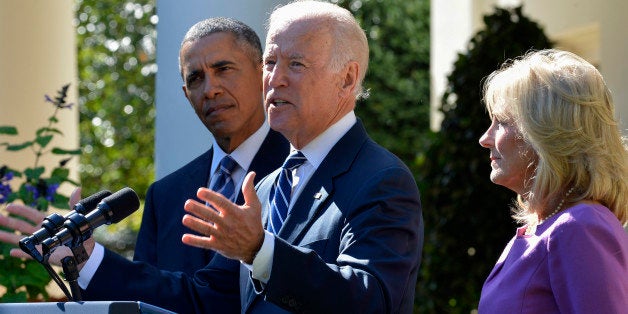 U.S. Vice President Joseph 'Joe' Biden, center, speaks in the Rose Garden of the White House with his wife Jill Biden, right, and U.S. President Barack Obama in Washington, D.C., U.S., on Wednesday, Oct. 21, 2015. Vice President Biden won't seek the Democratic presidential nomination in 2016, ending months of deliberation and speculation and clearing the path for Hillary Clinton. Photographer: Mike Theiler/Pool via Bloomberg