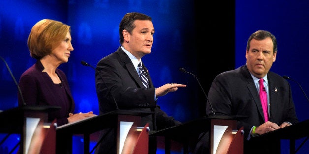 Ted Cruz, center, speaks as Carly Fiorina, left, and Chris Christie listen during the CNBC Republican presidential debate at the University of Colorado, Wednesday, Oct. 28, 2015, in Boulder, Colo. (AP Photo/Mark J. Terrill)