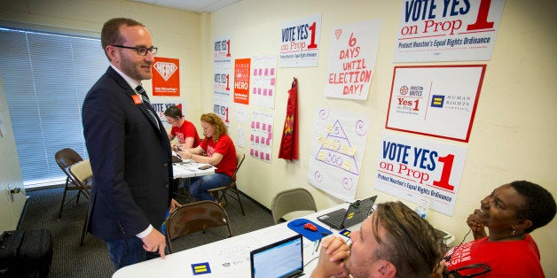 IMAGE DISTRIBUTED FOR HUMAN RIGHTS CAMPAIGN - Human Rights Campaign President Chad Griffin, left, speaks to staff and volunteers working a phone bank in Houston Wednesday Oct. 28, 2015, who are working to get out the vote for Prop 1 - Houston's Equal Rights Ordinance. (Michael Stravato/AP Images for Human Rights Campaign)