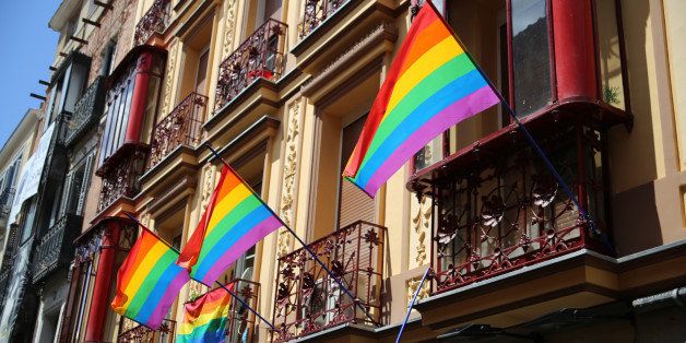 Rainbow flags hanging from the balconies of an old house in the Chueca neighborhood of Madrid, in occasion of the 2014 gay pride celebrations.