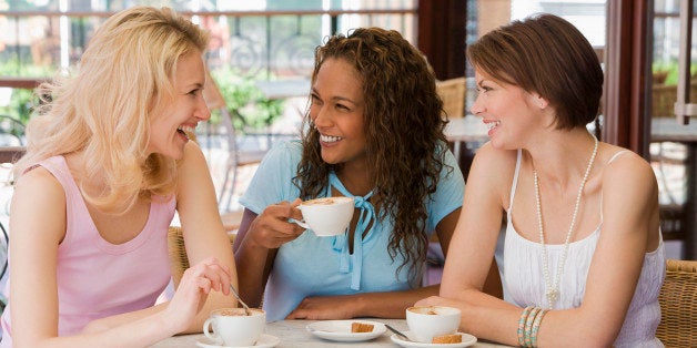 Friends talking in cafe