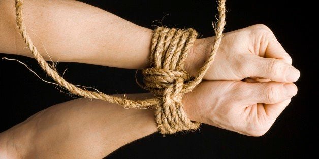 Wrists tied together with rope