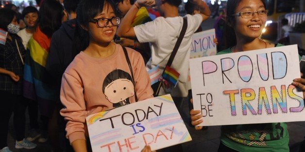 Members from the local lesbian, gay, bisexual and transgender (LGBT) community gather to celebrate a law newly approved by th