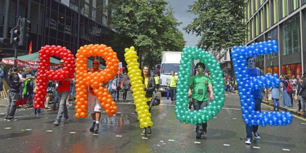 Parade sees thousands defy rain to celebrate the LGBT community.