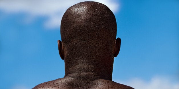 Muscular man photographed from behind.