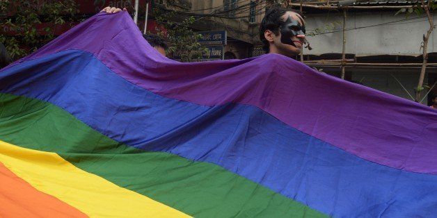 Indian members and supporters of the lesbian, gay, bisexual, transgender (LGBT) community attend a Rainbow Pride Walk in Kolkata on December 13, 2015. Marching in solidarity and in celebration of their diversity, the LGBT community demanded equal legal, social and medical rights. AFP PHOTO/ Dibyangshu SARKAR / AFP / DIBYANGSHU SARKAR (Photo credit should read DIBYANGSHU SARKAR/AFP/Getty Images)