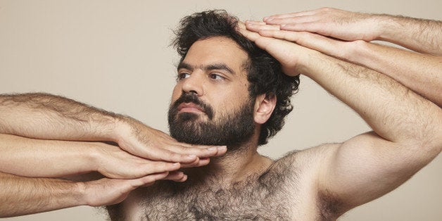 hairy chest, beard, curly black hair, arms, hands, beige background, hairy arms, vogue pose, fashion, studio lit, skin,