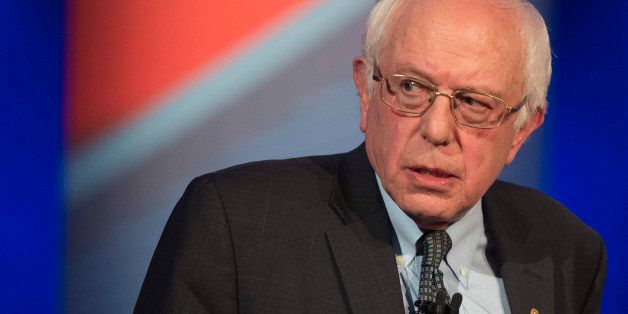 Democratic presidential candidate Bernie Sanders stands up after speaking at the CNN Town Hall at Drake University in Des Moines, Iowa, January 25, 2016, ahead of the Iowa Caucus. / AFP / JIM WATSON (Photo credit should read JIM WATSON/AFP/Getty Images)