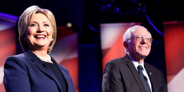 Democratic presidential candidates Hillary Clinton, left, and Sen. Bernie Sanders, I-Vt, pose for a photo before debating at the University of New Hampshire Thursday, Feb. 4, 2016, in Durham,NH (AP Photo/Jim Cole)
