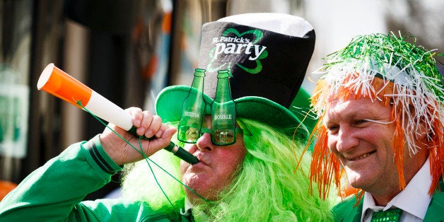 LONDON, ENGLAND - MARCH 13: Revellers take part in the St Patrick's Day parade through central London on March 13, 2016 in L