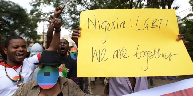 Kenyan gay and lesbian organisations demonstrate outside the Nigerian High Commission in Nairobi on February 7, 2014. Nigerian President Goodluck Jonathan in 2013 had signed a bill into law against gay marriage and civil partnerships. The Same Sex Marriage (Prohibition) Bill 2013 imposes penalties of up to 14 years' imprisonment for anyone found to have entered in to such a union. Anyone who founds or supports gay groups or clubs also runs the risk of a maximum 10-year jail term. The legislation, which effectively reinforces existing laws banning homosexuality in Nigeria, has been widely condemned abroad as draconian and against a raft of human rights conventions. AFP PHOTO/SIMON MAINA (Photo credit should read SIMON MAINA/AFP/Getty Images)