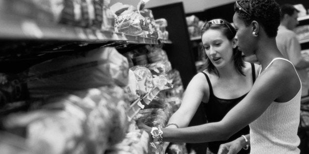 Couple Shopping for Bread in a Grocery Store