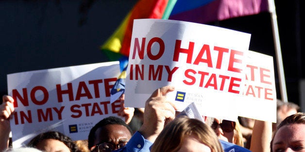 Protesters call for Mississippi Gov. Phil Bryant to veto House Bill 1523, which they says will allow discrimination against LGBT people, during a rally outside the Governor's Mansion in Jackson, Miss., Monday, April 4, 2016. (AP Photo/Rogelio V. Solis)