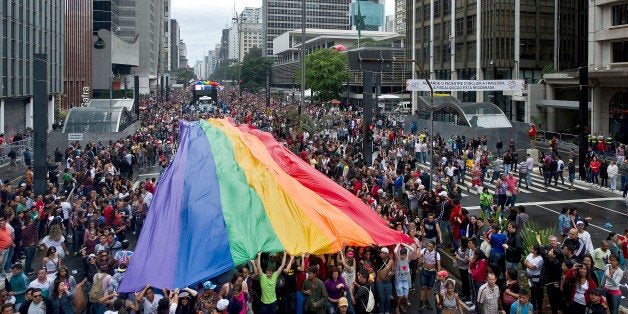 A huge rainbow flag is carried during the annual Gay Pride Parade in Sao Paulo, Brazil, on June 02, 2013. According to organi