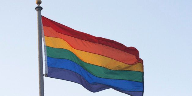 Rainbow flag blowing in wind