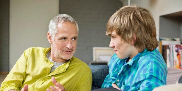 Man talking with his son at home