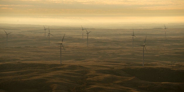 Wind turbines owned by PrairieWinds ND1 Inc., a subsidiary of Basin Electric Power Cooperative, seen at sunrise just south of Minot, N.D., Nov 6, 2013. Basin Electric is a consumer-owned, regional cooperative headquartered in Bismarck, N.D. It generates and transmits electricity to 137 member rural electric systems in nine states: Colorado, Iowa, Minnesota, Montana, Nebraska, New Mexico, North Dakota, South Dakota, and Wyoming. These member systems distribute electricity to about 2.8 million (Photo by Ken Cedeno/Corbis via Getty Images)