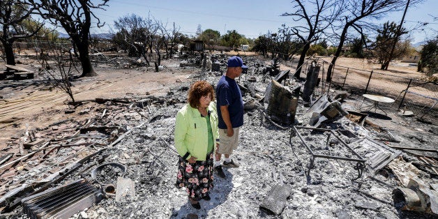 OAK HILLS, CA - AUGUST 19: Miguel and Mabel Ramos, both 73-year-old, are traumatized by the devastation caused by Blue Cut Fi