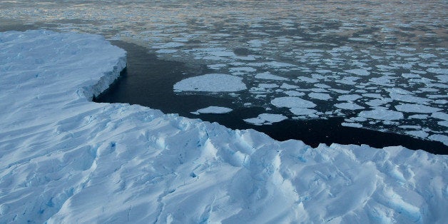 Giant tabular icebergs surrounded by ice floe drift in Vincennes Bay in the Australian Antarctic Territory on January 11, 200