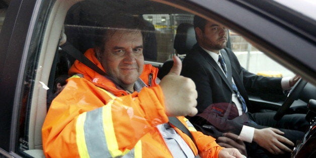 Montreal Mayor Denis Coderre gives a thumbs up after inspecting ongoing work of a sewer in Montreal November 12, 2015. Montreal, Canada's second-largest city, began dumping untreated sewage into the St. Lawrence River on Wednesday, angering environmentalists with a repair operation that could release as much as 8 billion liters (2.1 billion gallons) of wastewater into a major waterway. REUTERS/Christinne Muschi 