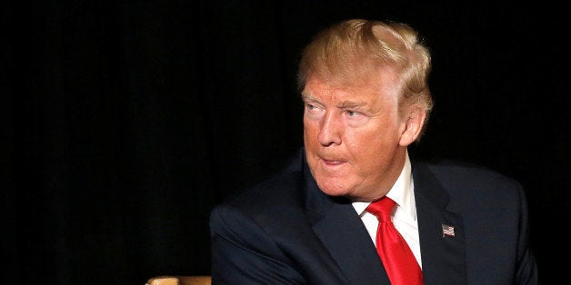 Republican presidential nominee Donald Trump listens to a question as he appears at the "Retired American Warriors" conference during a campaign stop in Herndon, Virginia, U.S., October 3, 2016. REUTERS/Mike Segar