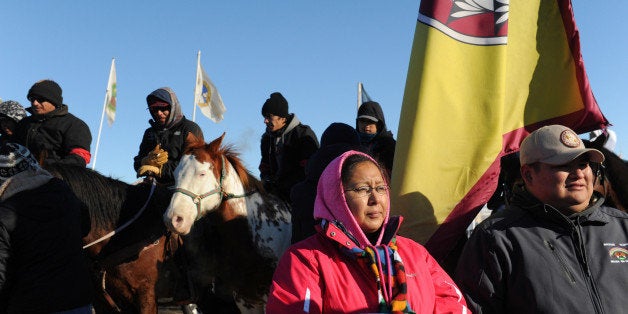 People gather in the center of Oceti Sakowin camp as "water protectors" continue to demonstrate against plans to pass the Dak