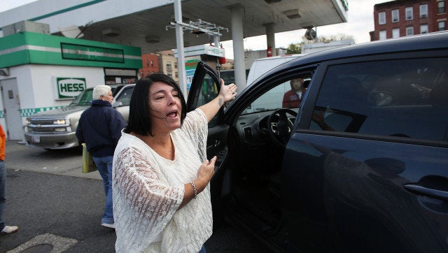 NEW YORK, NY - NOVEMBER 01: People argue as they wait in line for over two hour for gasoline as the city continues to recover from superstorm Sandy on November 1, 2012, in New York, United States. Limited public transit has returned to New York and most major bridges have reopened but will require three occupants in the vehicle to pass. With the death toll currently over 70 and millions of homes and businesses without power, the US east coast is attempting to recover from the effects of floods, fires and power outages brought on by superstorm Sandy. (Photo by Spencer Platt/Getty Images)