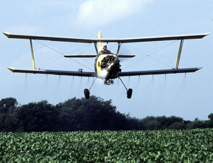 Near Sheldon, Illinois, grower Joe Zumwalt applies a low-insecticide bait that is targeted against western corn rootworms feeding on and ...