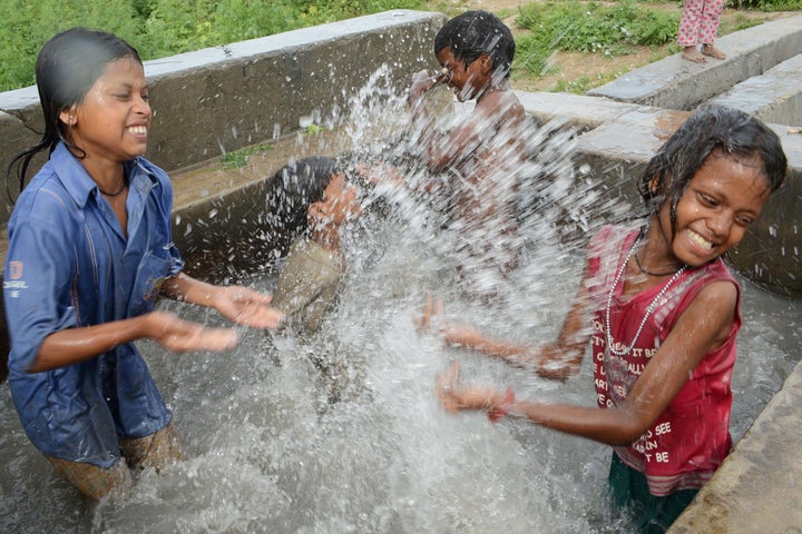 Indian children swim in an uncovered well, on World Water Day, on the outskirts of Amritsar on March 22, 2013. Eighty percent of sewage in India is untreated and flows directly into the nation's rivers, polluting the main sources of drinking water, a study by an environment watchdog showed. AFP PHOTO/NARINDER NANU (Photo credit should read NARINDER NANU/AFP/Getty Images)