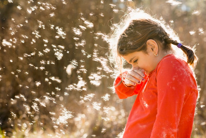 Girl suffering from allergies outdoors