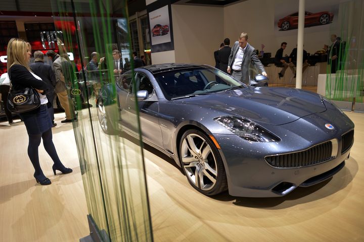 A Fisker Karma luxurious electric car is seen the US car maker's booth during the 83rd Geneva Motor Show on March 5, 2013. The top luxury segment, the Geneva show's main specialty, appeared oblivious to the crisis meanwhile. The European crisis hovered like a dark cloud over the Geneva International Motor Show, but there was no lack of new luxury cars shining on the showroom floor. McLaren, Ferrari and Lamborghini all unveiled so-called supercars to be sold for between one to three million euros ($1.3 - $3.9 million). AFP PHOTO / FABRICE COFFRINI (Photo credit should read FABRICE COFFRINI/AFP/Getty Images)