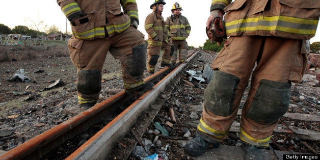 WEST, TX - APRIL 18: Valley Mills Fire Department personnel view the railroad tracks near to the fertilizer plant that explod