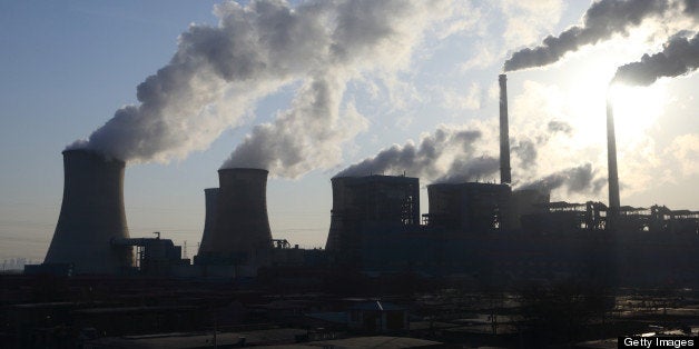 Steam rises from cooling towers at the Junliangcheng power station in Tianjin, China, on Wednesday, March 13, 2013. China's money-market rate rose to a one-week high after central bank Governor Zhou Xiaochuan said yesterday the nation should be on 'high alert' over inflation. Photographer: Tomohiro Ohsumi/Bloomberg via Getty Images