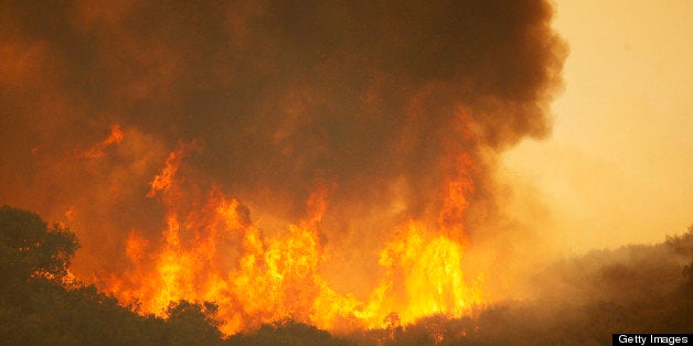 CAMARILLO, CA - MAY 3: A main fire front approaches the Blackiston Ranch as the Springs fire continues to grow on May 3, 2013 near Camarillo, California. The wildfire has spread to more than 18,000 acres on day two and is 20 percent contained. (Photo by David McNew/Getty Images)