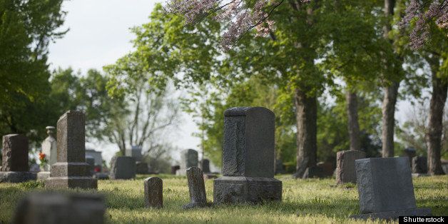 gravestones in a cemetery with...