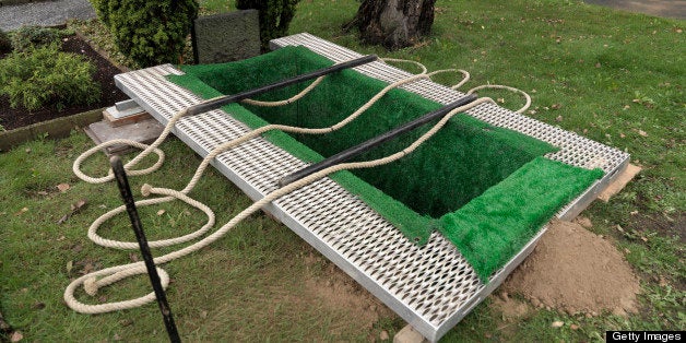 Freshly prepared grave at cemetery.