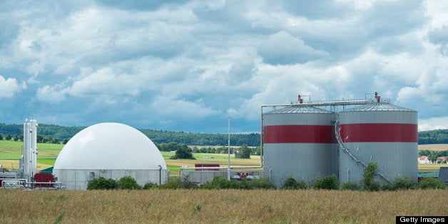 Biomass energy plant in a rural landscape under a dramatic cloudscape. Toned picture 