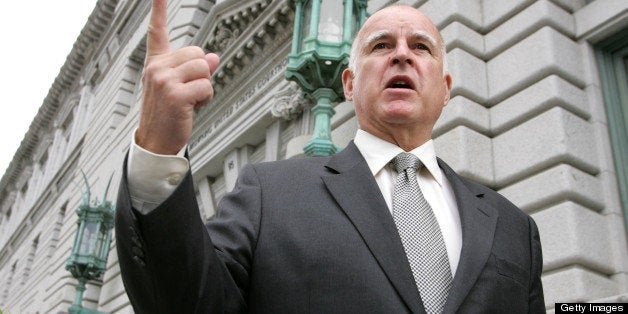 SAN FRANCISCO - MAY 14: California Attorney General Jerry Brown speaks to reporters outside of the Ninth U.S. Circuit Court of Appeals May 14, 2007 in San Francisco, California. Attorney General Brown and the state of California along with several other states are in a lawsuit against the Bush administration challenging an April 6, 2006 decision by the National Highway Safety Administration to approve a one mile per gallon increase in fuel efficiency from 22.2 m.p.g. to 23.5 by the year 2010. Brown says the government was negligent in this decision by not considering the impact of greenhouse gas emissions and global warming and that the gas mileage standards should be tougher. (Photo by Justin Sullivan/Getty Images)