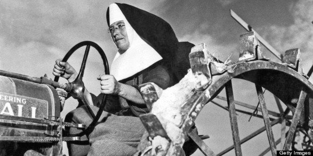 Sister Mary Othelia drives one of the Mount Asissi Convent's tractors across the fields where the nuns do all of the planting and harvesting on the 100 acre farm, Lemont, Illinois, August 4, 1942. (Photo by Underwood Archives/Getty Images)