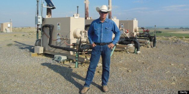 John Fenton, a local farmer, stands next to an Encana Corp. gas well near his home in Pavillion, Wyoming, U.S., on July 5, 2012. The U.S. Environmental Protection Agency said in a draft report last December that this area is the nation?s one established incident of water contamination from hydraulic fracturing, a drilling technique that has surged across the country. Photographer: Mark Drajem/Bloomberg via Getty Images