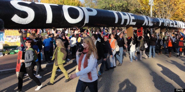 Thousands of protesters encircled the White House in Washington, D.C., Sunday, November 6, 2011, to demonstrate against the proposed Keystone XL oil pipeline. (Daniel Lippman/MCT via Getty Images)