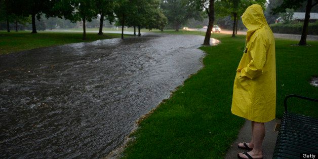 DENVER, CO - JULY 13: John Waldorf, stands along side a swollen gulch at McWilliams Park near Yale Ave and Fillmore St. in Denver Colorado, July 13, 2013 after a heavy rainstorm. (Photo By Andy Cross/The Denver Post via Getty Images)