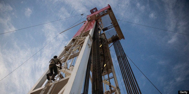 WATFORD CITY, ND - JULY 23: Jeff Allyn, a derrick hand with Raven Drilling, climbs up to the top of the derrick while drilling for oil in the Bakken shale formation on July 23, 2013 outside Watford City, North Dakota. North Dakota is been experiencing an oil boom in recent years, due in part to new drilling techniques including hydraulic fracturing and horizontal drilling. In April 2013, The United States Geological Survey released a new study estimating the Bakken formation and surrounding oil fields could yield up to 7.4 billion barrels of oil, doubling their estimate of 2008, which was estimated at 3.65 billion barrels of oil. 'If you're not working out here, there's no excuses. I went to prison for six years - it doesn't matter what your past is,' Allyn said. (Photo by Andrew Burton/Getty Images)
