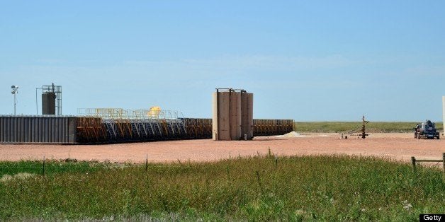 Natural gas is burned off next to water reservoirs used for fracking at an oil well site August 23, 2011 near Tioga, North Dakota. Hydraulic fracturing, often called fracking or hydrofracking, is the process of initiating and subsequently propagating a fracture in a rock layer, employing the pressure of a fluid as the source of energy The fracturing, known as a frack job is done from a wellbore drilled into reservoir rock formations, in order to increase the extraction rates and ultimate recovery of oil and natural gas and coal seam gas. A new oil boom in western North Dakota has produced thousands of jobs as the Bakken formation is tapped for the liquid commodity. AFP PHOTO / Karen BLEIER (Photo credit should read KAREN BLEIER/AFP/Getty Images)