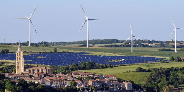 Wind turbines and a solar park are pictured on May 26, 2013 near the village of Avignonet-Lauragais, located southeast of Toulouse in the Midi-Pyrenees region. AFP PHOTO / REMY GABALDA (Photo credit should read REMY GABALDA/AFP/Getty Images)
