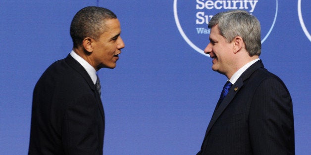 Canadian Prime Minister Stephen Harper shakes hands with US President Barack Obama as he arrives for a dinner during the the Nuclear Security Summit April 12, 2010 in Washington, DC. AFP PHOTO / JEWEL SAMAD (Photo credit should read JEWEL SAMAD/AFP/Getty Images)