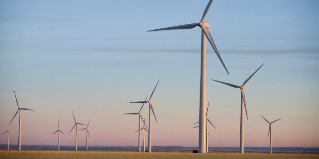 A group of wind turbines in Montana seen at sunset