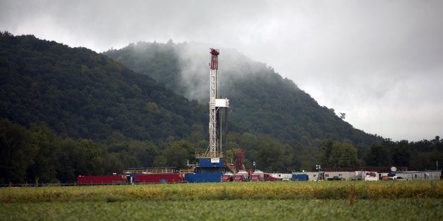 FAIRFIELD TOWNSHIP, PA - SEPTEMBER 8: A soybean field lies in front of a natural gas drilling rig September 8, 2012 in Fairfi