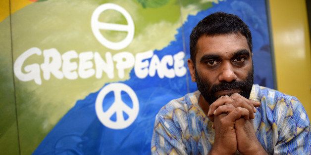 Kumi Naidoo, of south Africa and international executive director of Greenpeace, poses for a photo during an interview with AFP in Manila on June 3, 2013. A billion-dollar-deal to save Indonesia's rainforests has slowed a 'tidal wave' of logging destruction, Greenpeace's global chief said Monday, but he warned much more needed to be done. AFP PHOTO/TED ALJIBE (Photo credit should read TED ALJIBE/AFP/Getty Images)