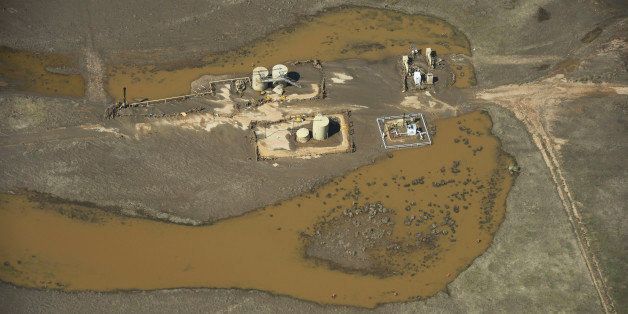 WELD COUNTY, CO - SEPTEMBER 19: Gas wells and oil storage tanks surrounded with flood water in Weld County Colorado near the town of Milliken Thursday afternoon, September 19, 2013. (Photo By Andy Cross/The Denver Post via Getty Images)